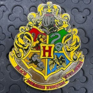 Warner Brothers Harry Potter studio tour London exclusive Hogwarts crest pin